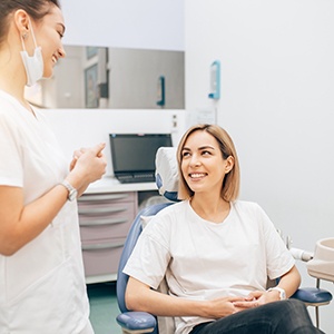 Patient smiling at dentist in treatment room
