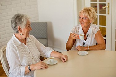 Ladies converse over coffee