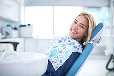 Woman smiling while relaxing in treatment chair