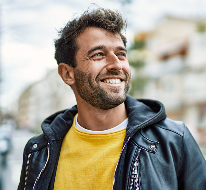 Man in a leather jacket outdoors