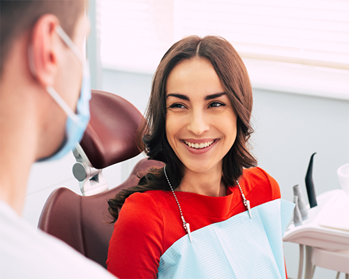 Woman smiling at her dentist