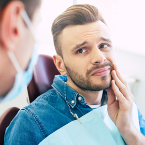 A man seeing his dentist for gum disease treatment